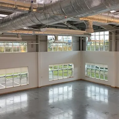 a large empty room with lots of windows
