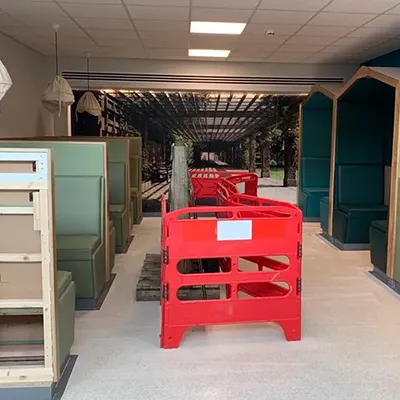 a room filled with lots of green and red furniture